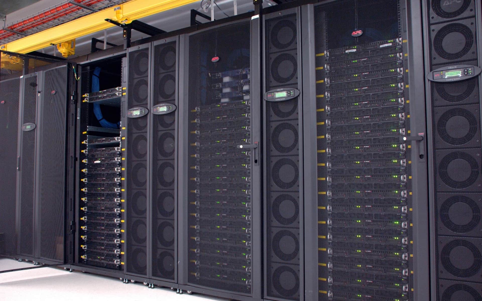 A rack of accelerator nodes in a data centre, status lights running the height of every cabinet.